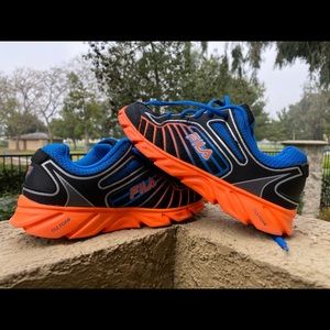 Kids Fila running shoes orange and blue.